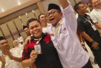 Amir Mahmud dan Yasir mahmud saat bertemu i pengundian Paslon, Senin 22/9/2024