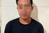 Terduga pelaku saat diamanakan polisi.